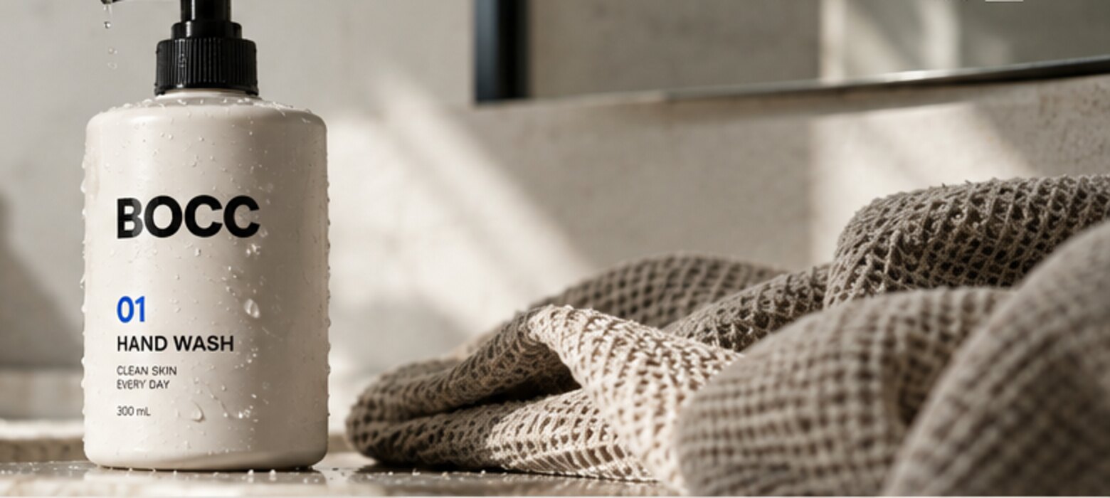 BOCC packaging concept beside a textured towel in natural bathroom light