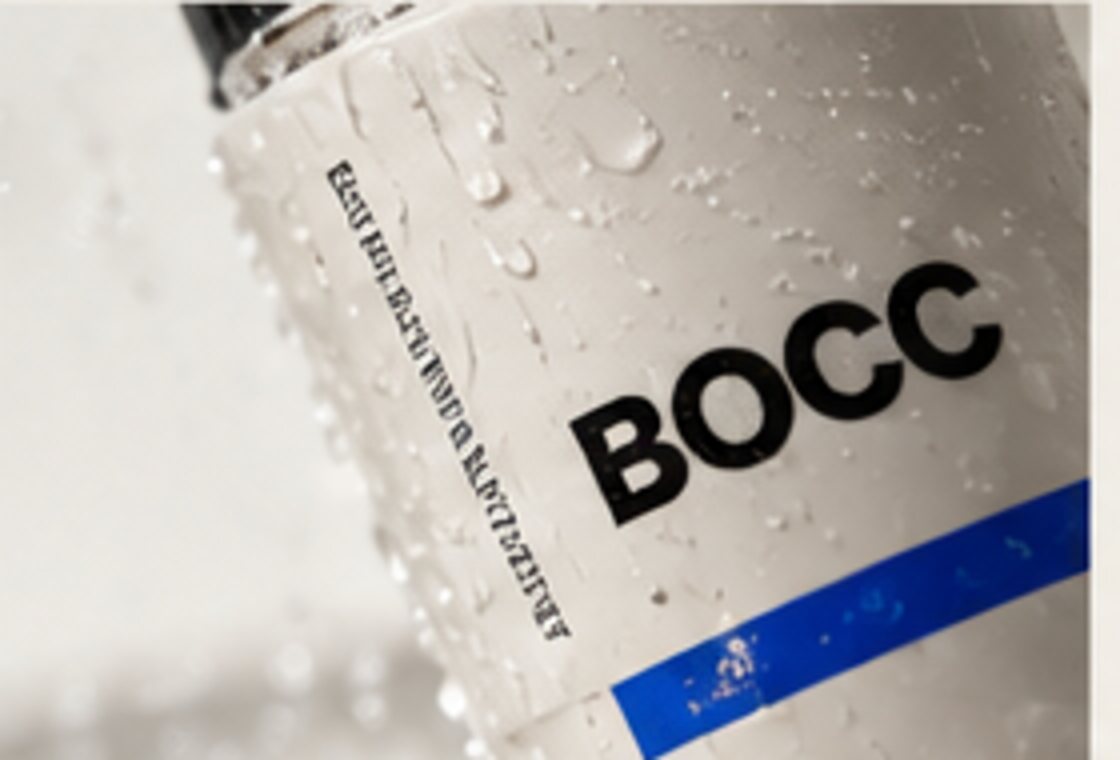 Close-up packaging study with BOCC wordmark and restrained blue detail